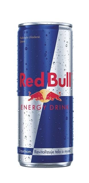 A Red Bull energy drink can with blue and silver coloring and the iconic red bull logo